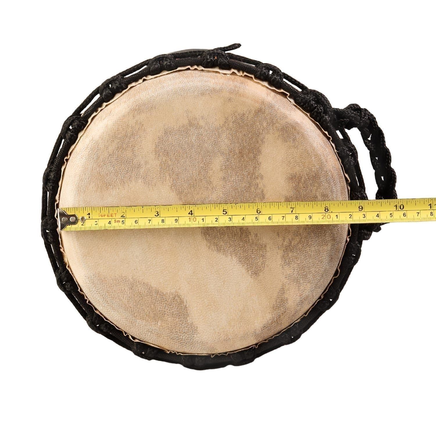 Top-down view of a djembe drum with a goatskin head and black rope tuning. A measuring tape indicates the diameter of the drumhead - Natural Wide Top 9 inch diameter, 40cm high.