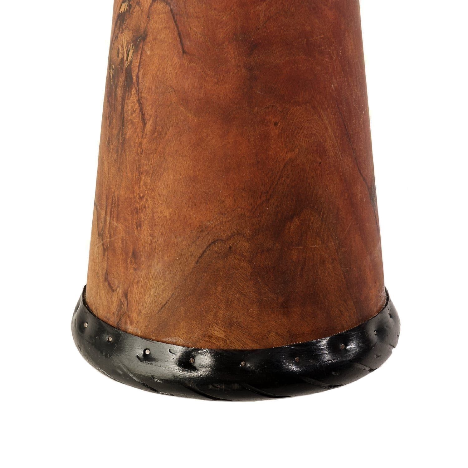 Close-up of a handcrafted wooden djembe drum base with a polished finish and decorative black rim, highlighting intricate craftsmanship.