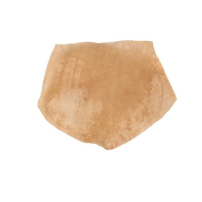 This natural goatskin drumhead is a replacement head for a 14-inch diameter Djembe drum, ready to be stretched and fitted for optimal sound quality.