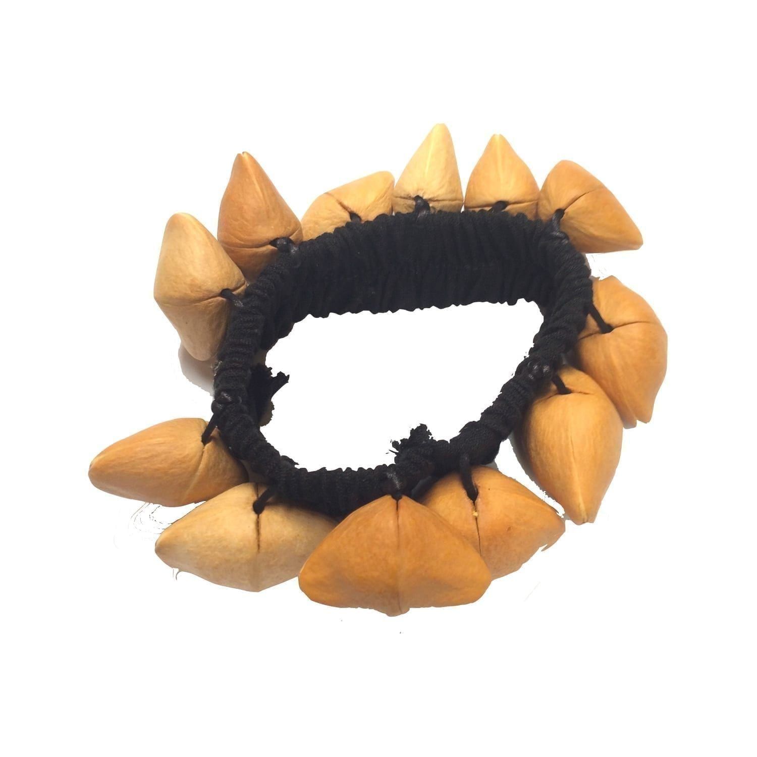 This is a product image of the Ankle Shaker - Kenari. It has a black elastic strap with light brown Kenari shells attached all the way around.