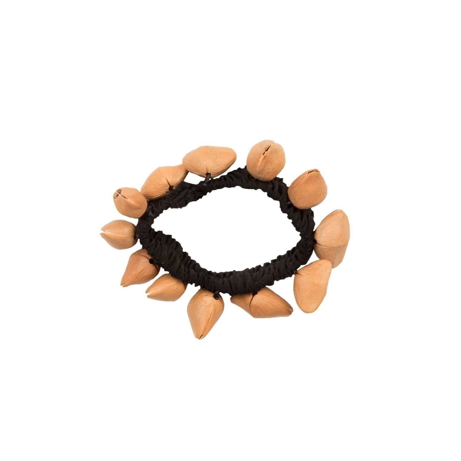 Ankle Shaker - Kenari. It has a black elastic strap with light brown Kenari shells attached all the way around.