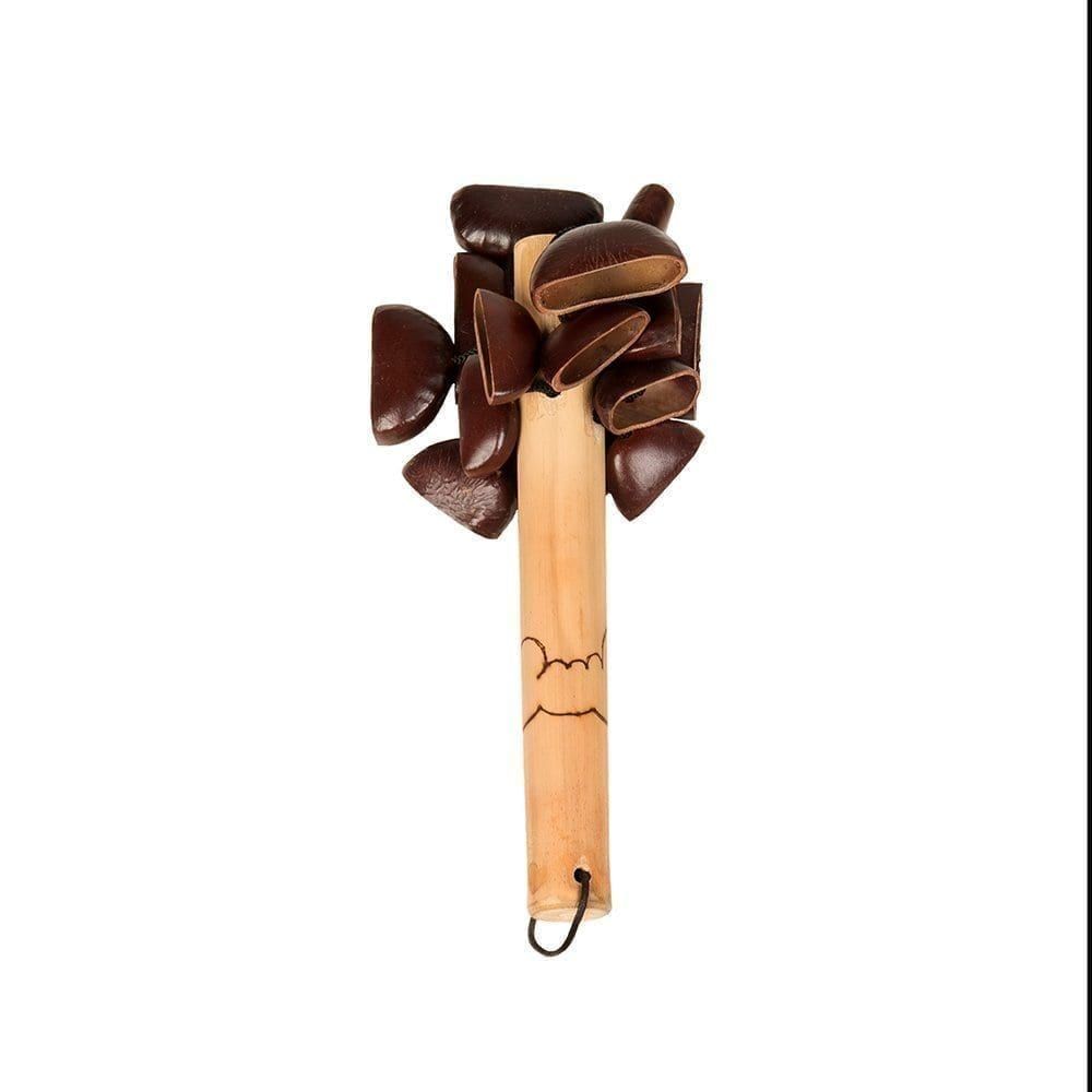 This is a product shot of a Bento Shaker - Early Years, upright shot. It has a small wooden handle with a design burnt into the wood. At the top are many Bento seeds are attached which make the shaker sound.