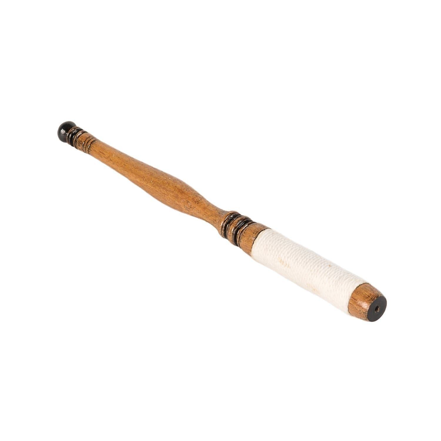 This is a product image of the Bonang Beater (Pangul). It is a wooden beater made of wood. The playing end is wrapped tightly in string to create a softer surface for striking Bonang. The beater is laid flat and is pointing down and to the right.