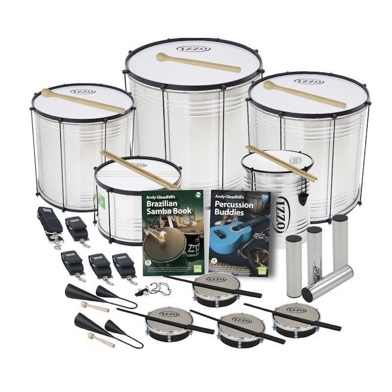 This is a product image of the Brazilian Samba - Secondary - 15 Player Economy Class Pack. The products are laid out and include the following; Back Row - One Surdo - Economy - 14in diameter, aluminium, Izzo (Silver), one Surdo - Economy - 18in diameter, aluminium, Izzo (Silver), one Surdo - Economy - 16in diameter, aluminium, Izzo (Silver). Second Row - One strap for the Caixa, four straps for the Surdos and Repinique, one Caixa - Economy - 12in diameter, aluminium, Izzo (Silver), Andy Gleadhill's Brazilian Samba Book, Andy Gleadhill's Percussion Buddies Book, one Repinique - Economy - 10in diameter, aluminium, Izzo (Silver), four Ganza. Bottom Row - Two Agogo Bells - Medium, one Tritone Samba Whistle (Apito), four Tamborim - Izzo. All of the drums have a suitable beater or stick lying on top of their skin.