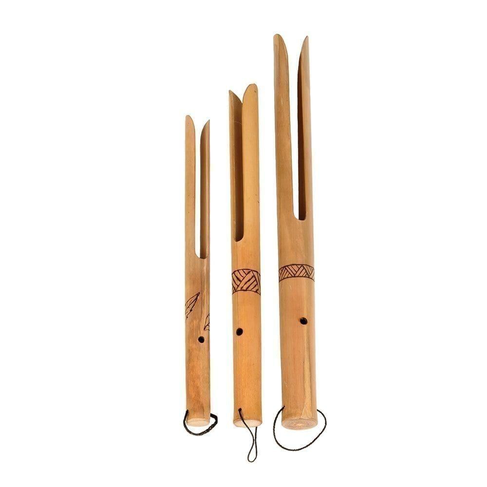 This is a product image of Buzzers - Set of 3, bamboo. Each one is made of a single piece of bamboo. A hole is visible in the neck before it splits into two fingers of wood at the end. There is a line pattern burned in halfway down each neck. The instruments are facing straight upwards and are sized smallest to largest from left to right.