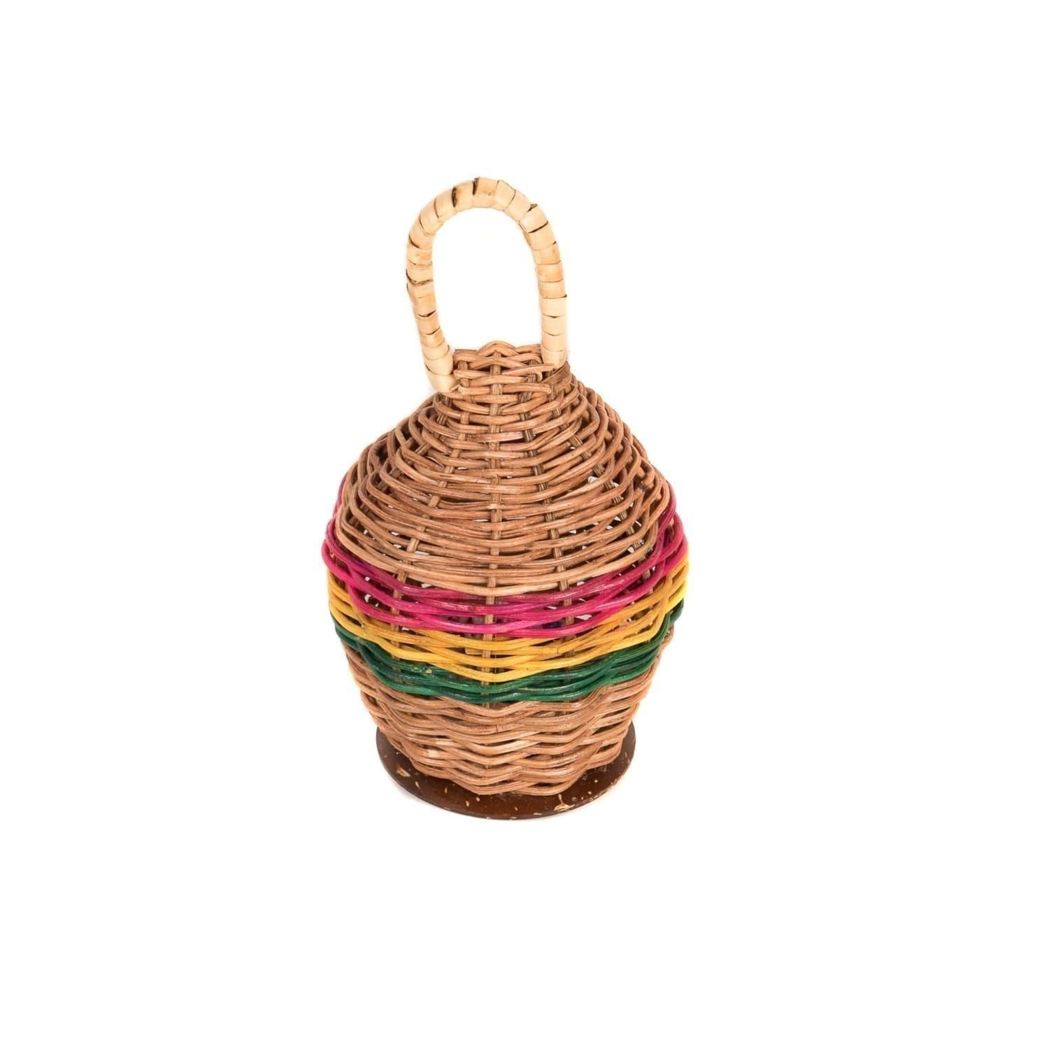 This is a product image of a Caxixi Basket Shaker. It is a woven wicker basket that is competely enclosed with a handle at the top. It has been painted around the circumference in pink, yellow and green.