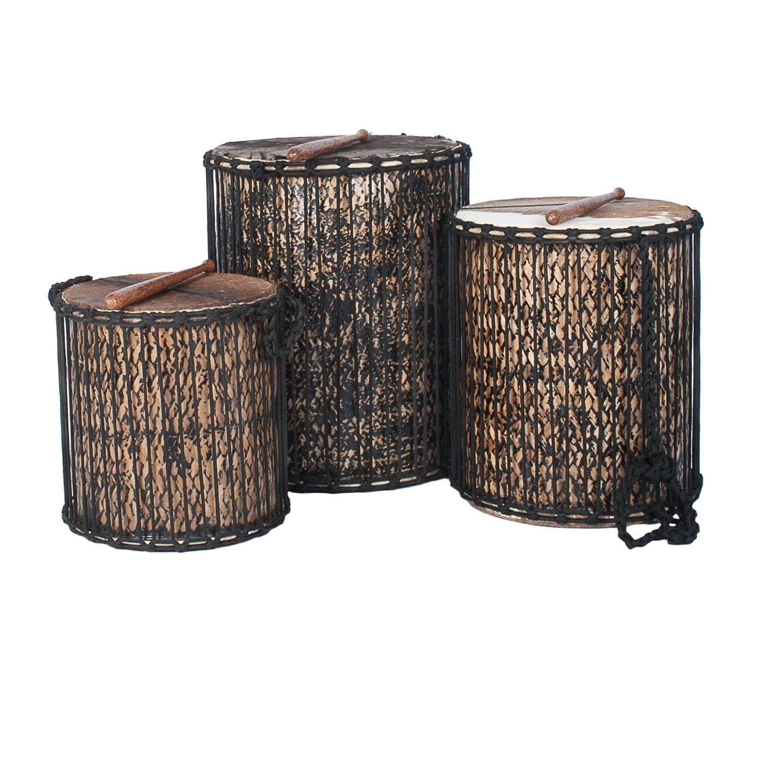 This is a product image of a Dundun Set - Large - bamboo from the side with a beater resting on each drum. It contains a Kenkeni: 35cm diameter by 40cm high, a Dundun: 45cm diameter by 60cm high and a Sangban: 40cm diameter by 50cm high.
