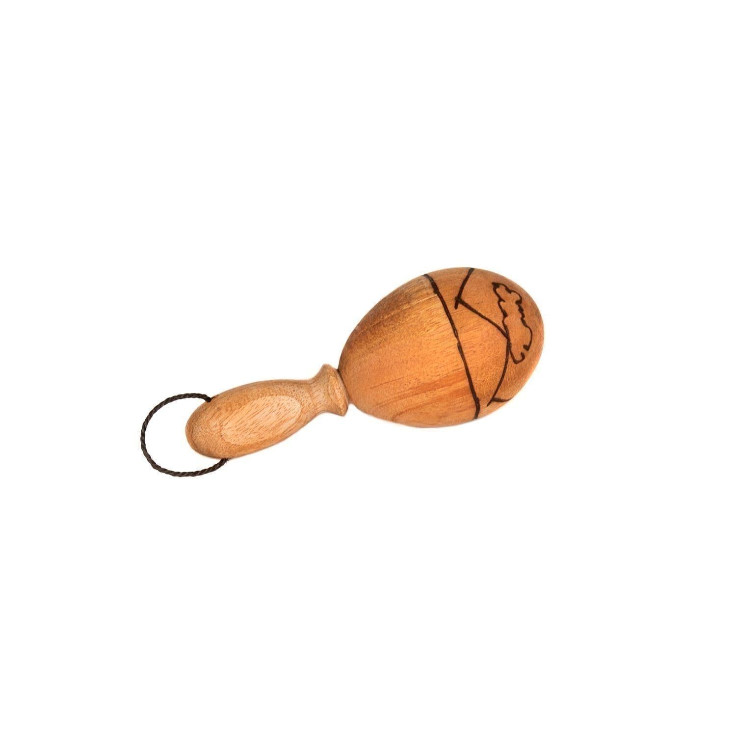 This is a product image of the Egg on Stick - Large - 7cm, Early Years. It is a wooden egg shaker on a wooden handle. There is a line design burned into the egg as decoration. The instrument is laying down facing from left to right.