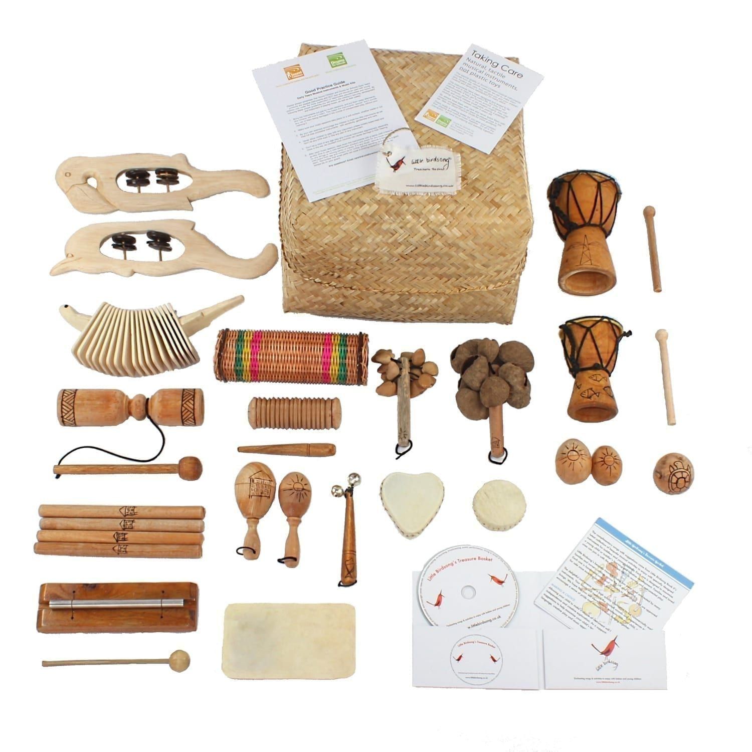 Little Birdsong Treasure Basket - 22 Instruments, with the contents laid out flat outside of the basket.