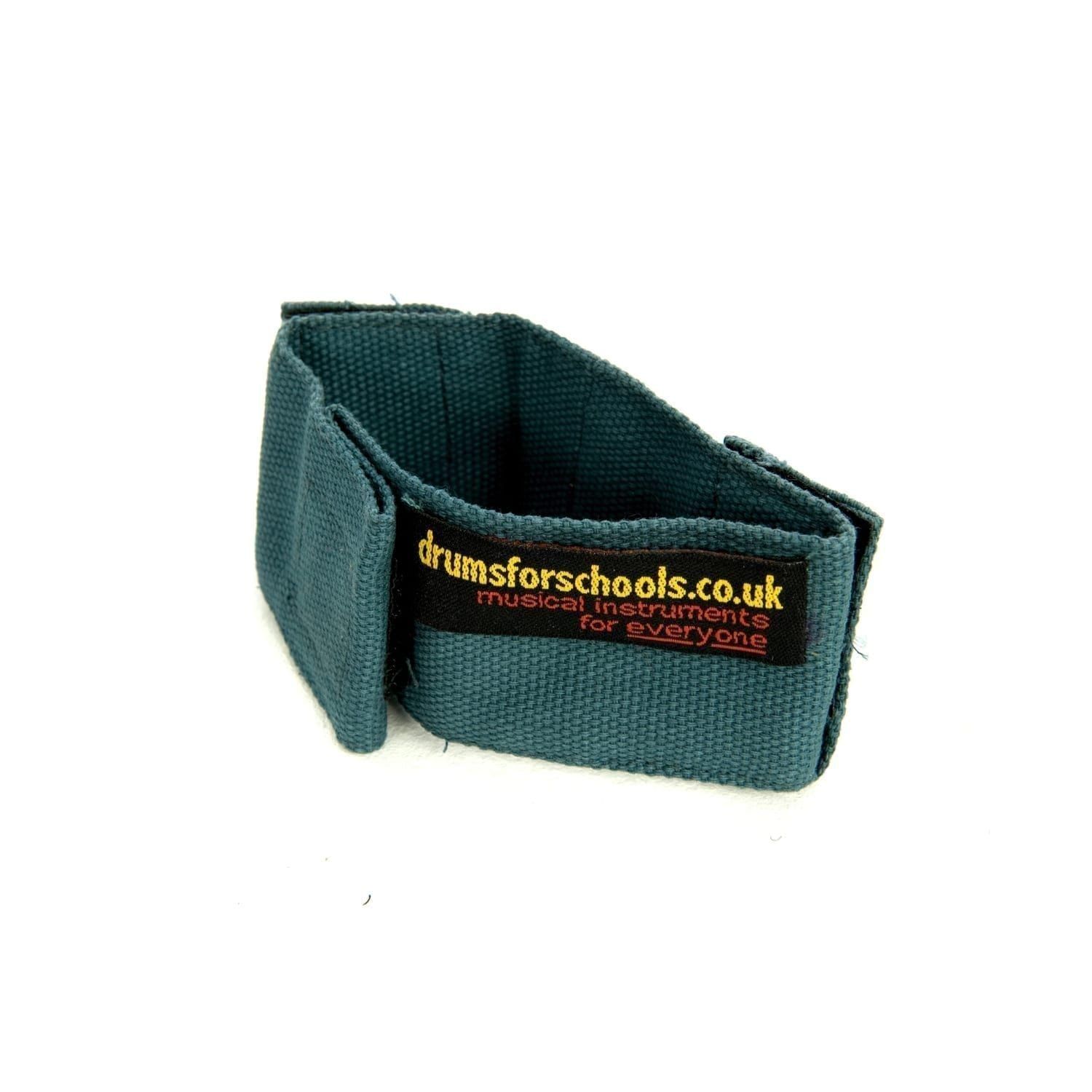This is a product image of the Music Bracelet - medium. It is blue in colour and has a couple of Velcro loops for attaching shakers and other instruments.