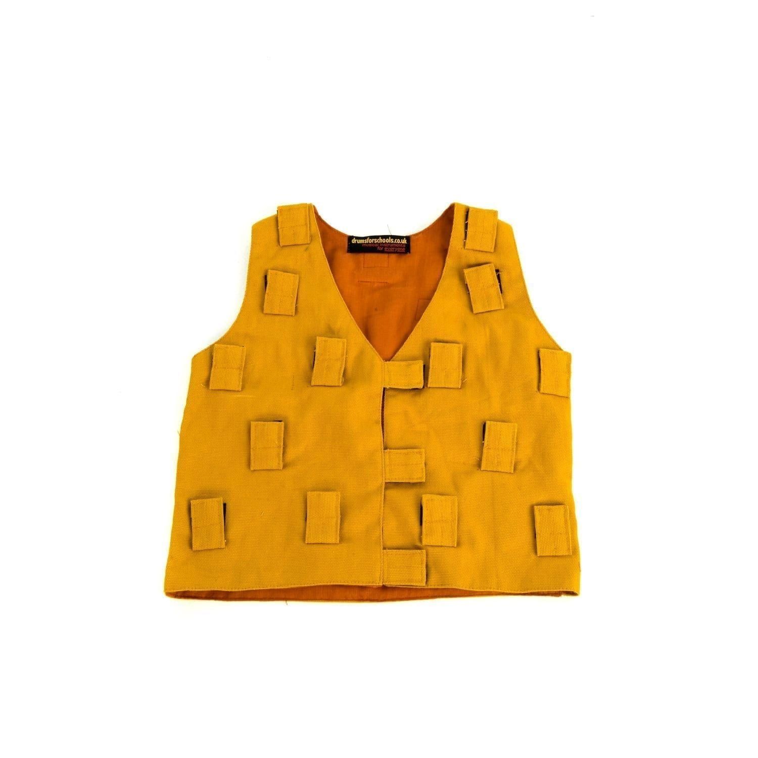 This is a product image of the Music Tunic - Small. It is laid out flat and is yellow in colour. There are lots of Velcro tab sections to attach various shakers.