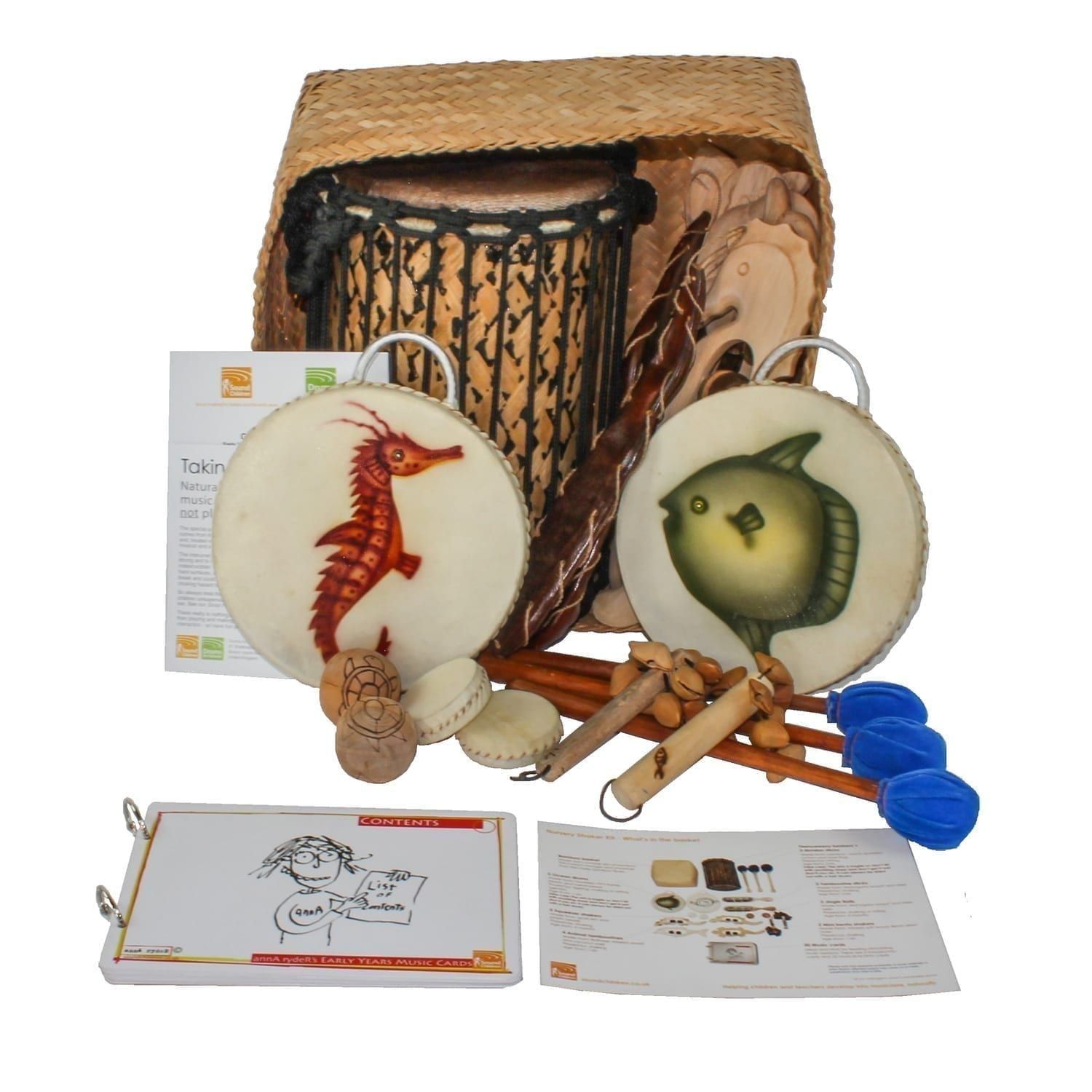 This is a product image of the Nursery Shaker Kit - 15 Instruments. The products are presented inside and around the Storage Basket with the documentation in front.