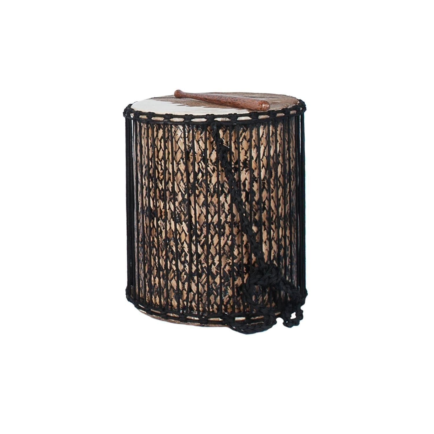 This is a product image of the Sangban - 16in diameter, 50cm high, bamboo. It is standing upright with one of the handles draped downwards at the front. A Dundun Beater is lying on top of the drum.