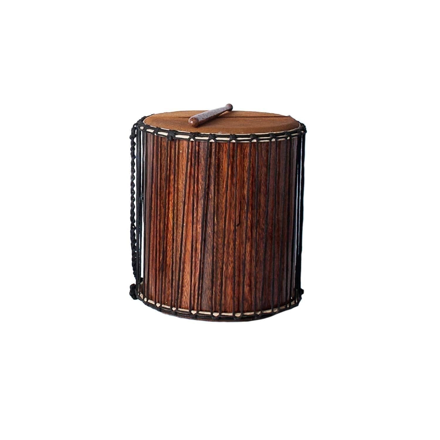 This is a product image of the Sangban - 16in diameter, 50cm high, recycled wood. It is standing upright with one of the handles draped downwards to the left. A Dundun Beater is lying on top of the drum.