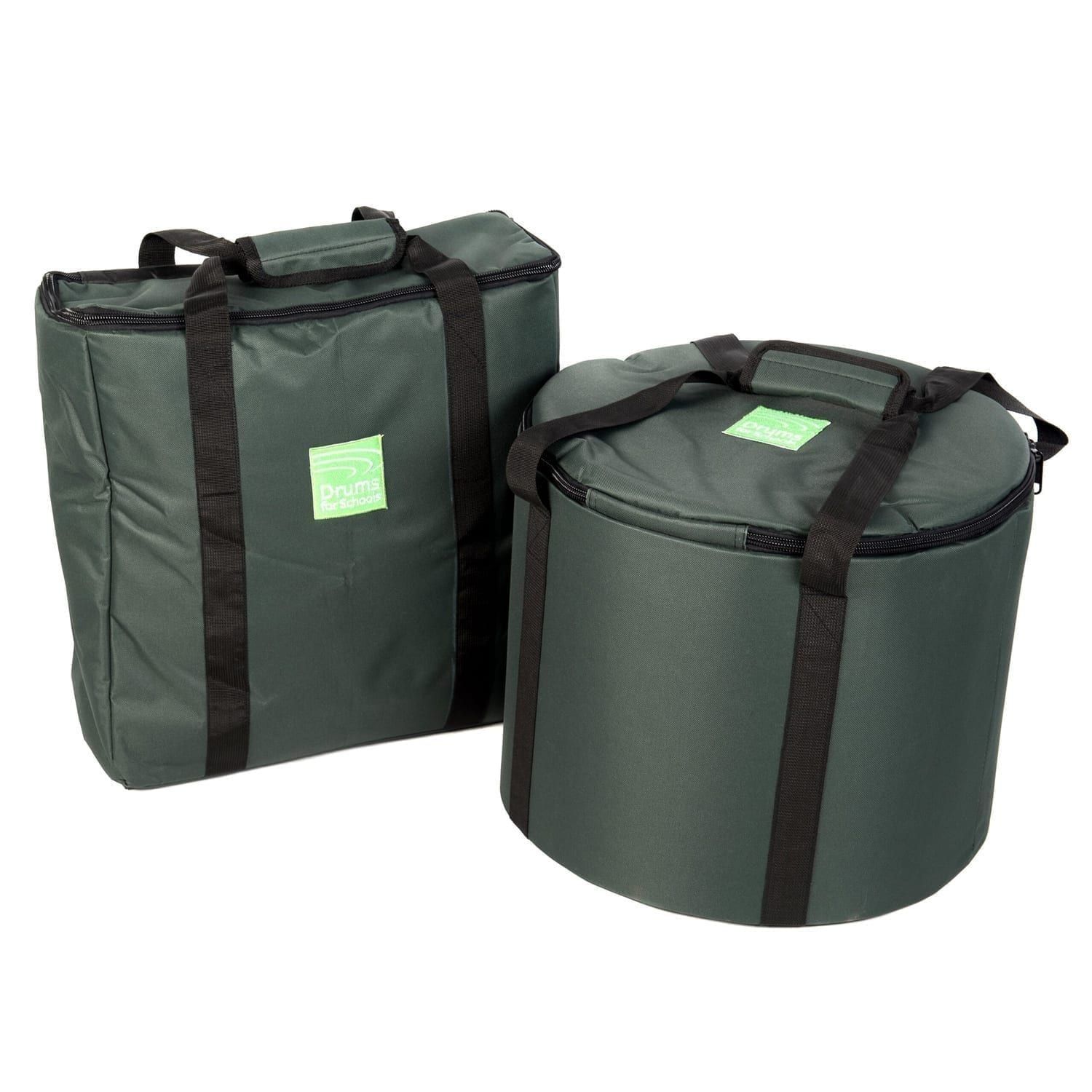This is a product image of the Storage Carry Bag for 5 x Jumbie Jam Steel Pans. There are two bags in shot. The left hand bag is a rectangle and will carry the stands. The right hand bag is a cylinder and will carry the pans themselves. Both of the bags are green, have straps for carrying and have zipped sections at the top.