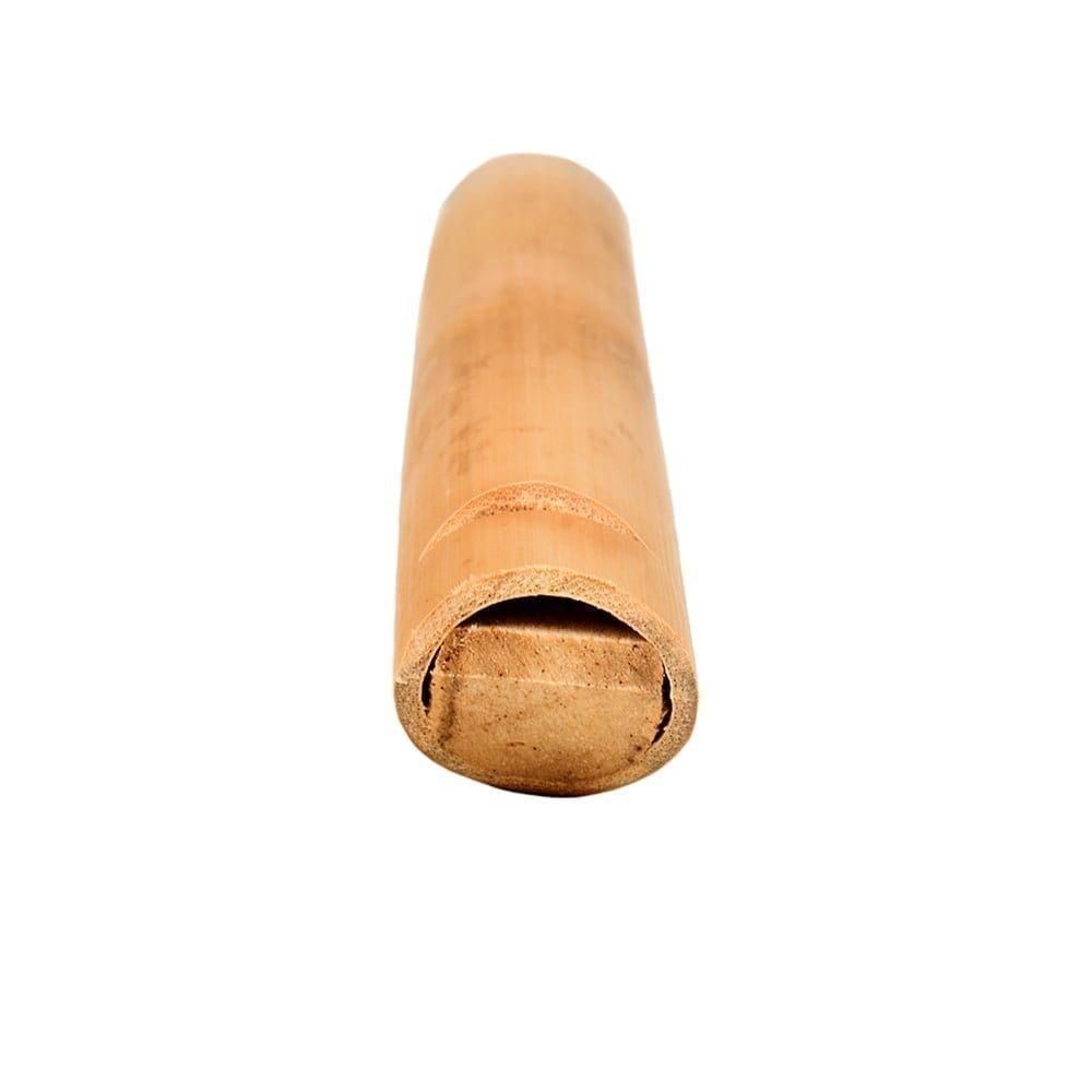 Swanee Whistle - 20cm, natural, bamboo, with mouth piece detail. It is a bamboo tube that has a mouth piece at one end and a wooden slide inserted into the other. The instrument is lying flat and angled from bottom right to top left.