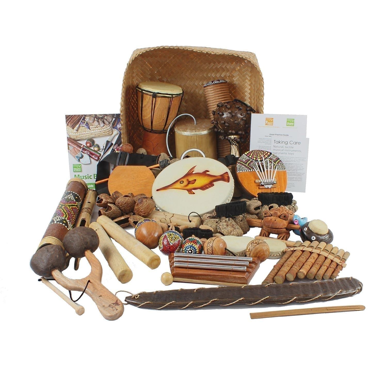 This is a product image of the World Music Basket - Large - 30 Instruments. The large array of products are presented within and around the Storage Basket, with the documentation either side.