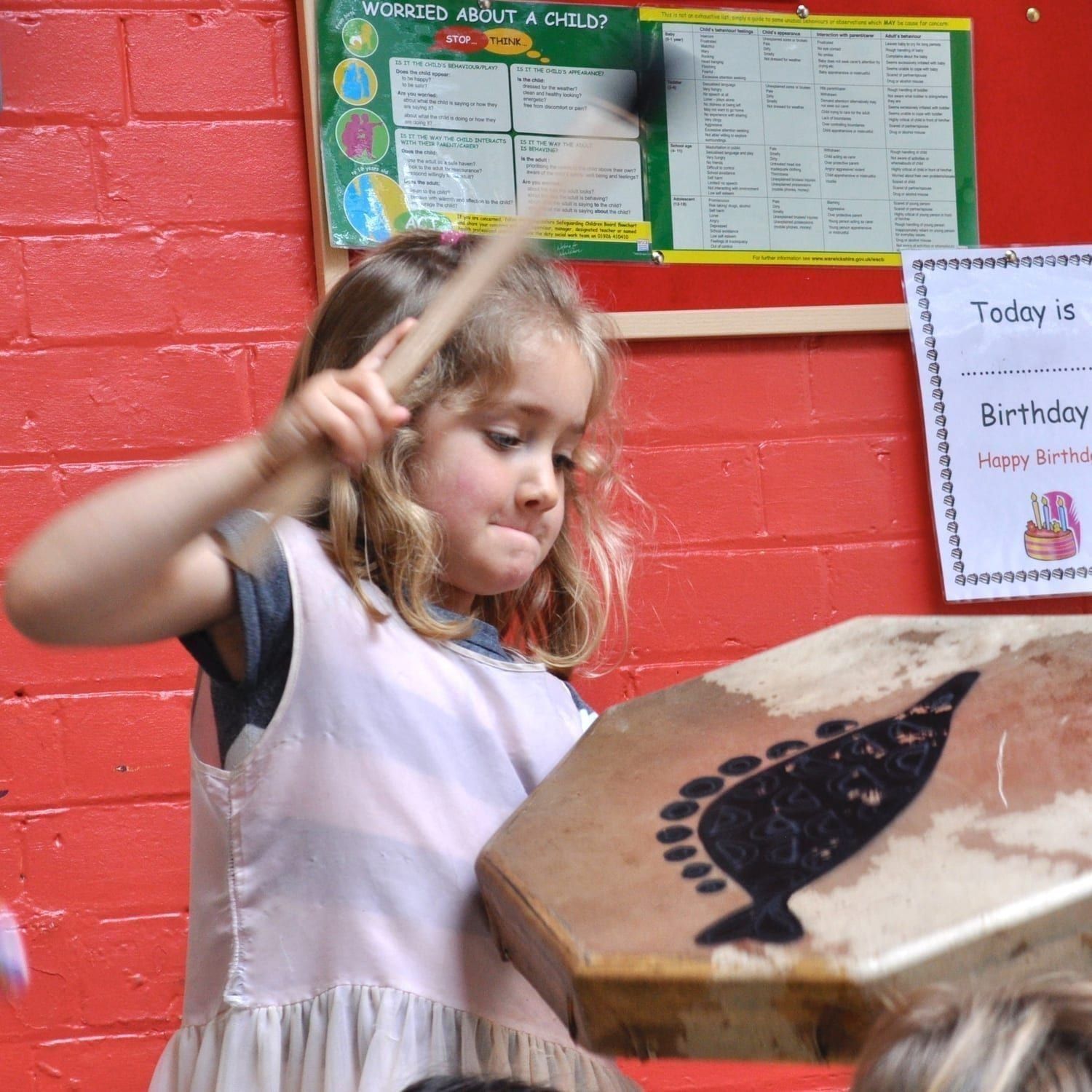 This is a product image of Drums for Schools' Shaman Drum 16in, 40cm diameter painted, played in action.