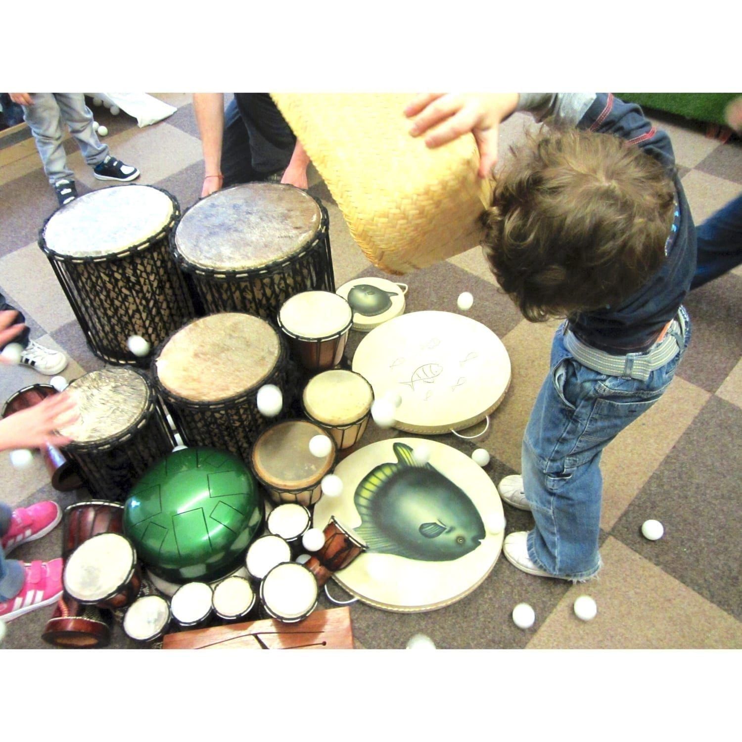 Action shot of 100 ping pong balls being played with Drums for Schools' instruments
