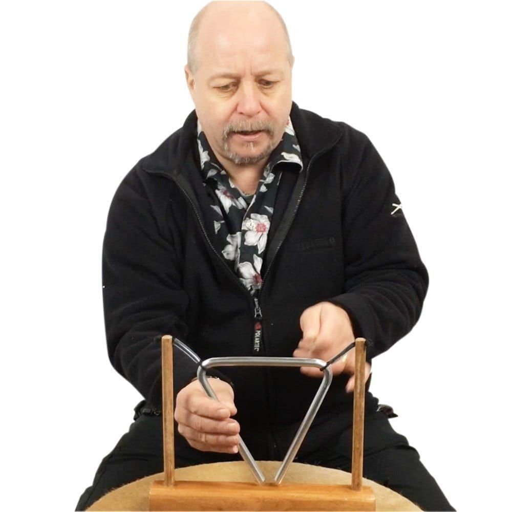 Image of Andy Gleadhil demonstrating how to play Triangle on stand 