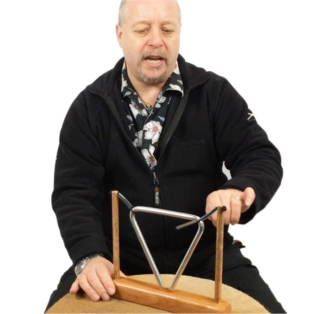 Image of Andy Gleadhil demonstrating how to play Triangle on stand 