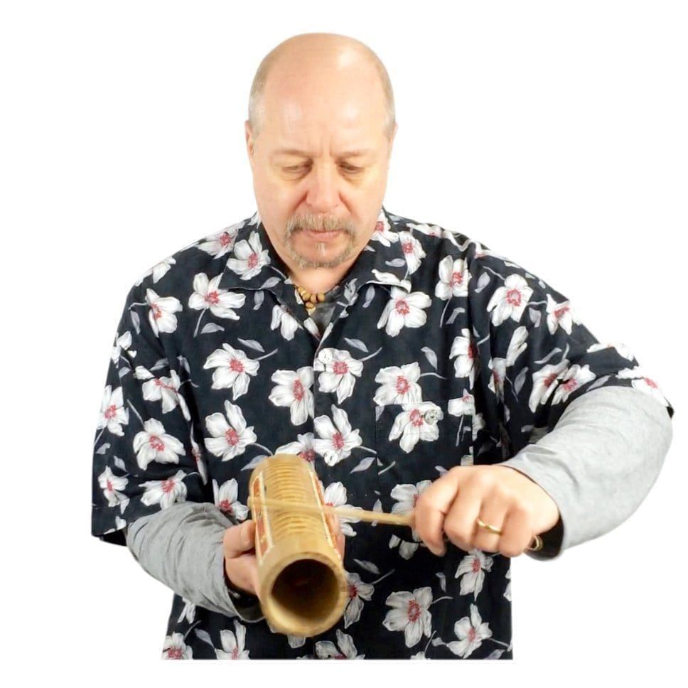Image of Andy Gleadhil demonstrating how to play Guiro Bamboo