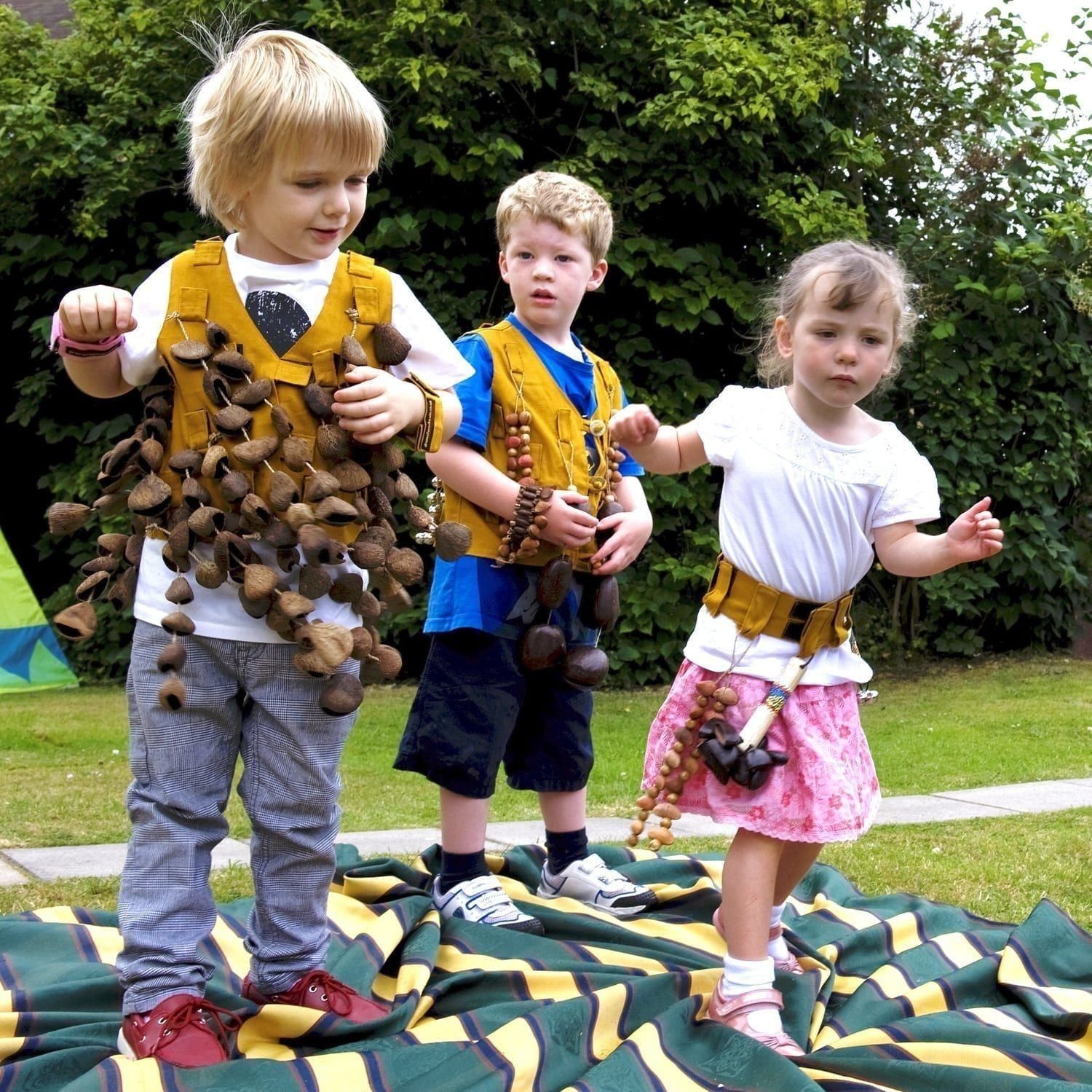 Image of preschool students playing with Drums for Schools' music tunic and music belt