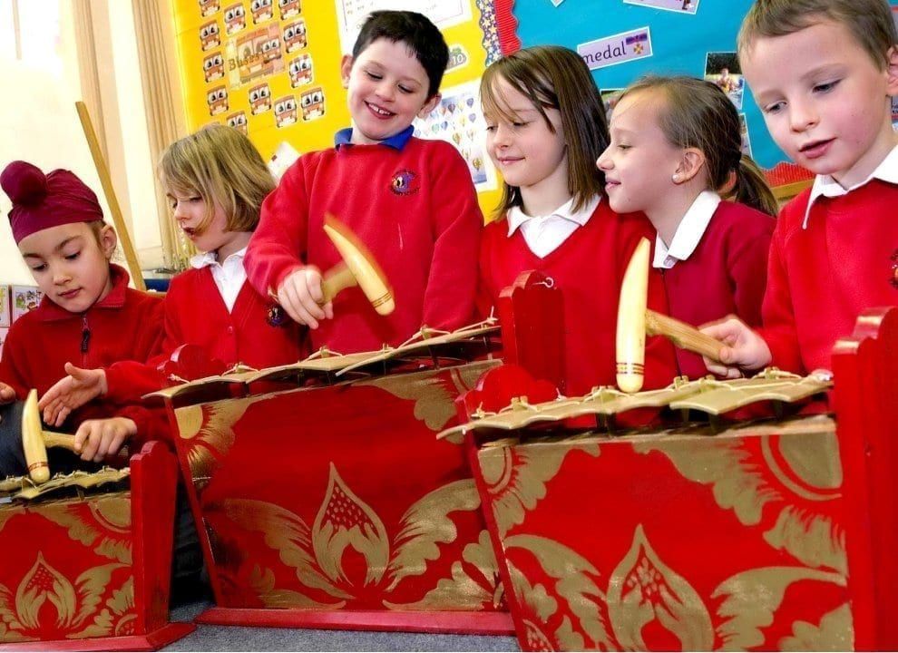 Teacher leading a drumming class