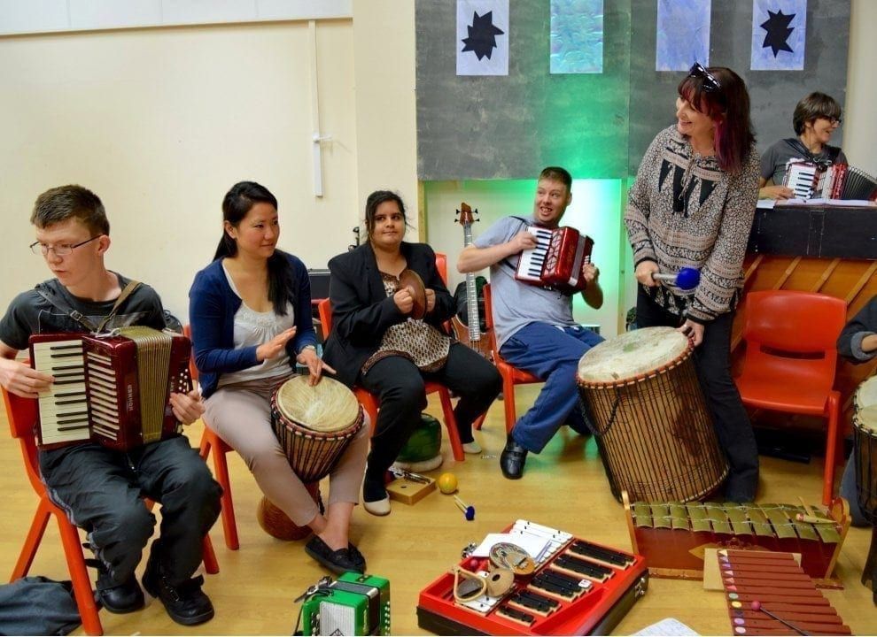 People of all abilities playing music together
