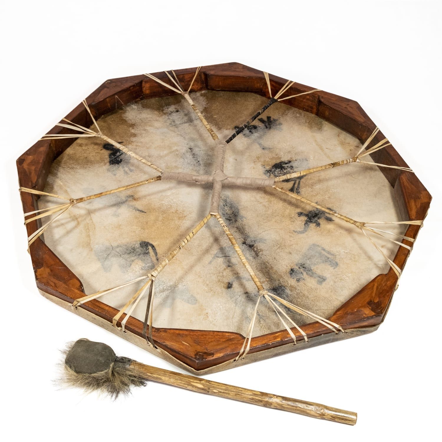 Photo of Drums for Schools Shaman Drum – 28in (70cm) diameter (OW-shdrpa70), painted, and its double-sided beater. back side. This octagonal frame drum has a variety of beautiful African animal designs painted on the goatskin playing surface.