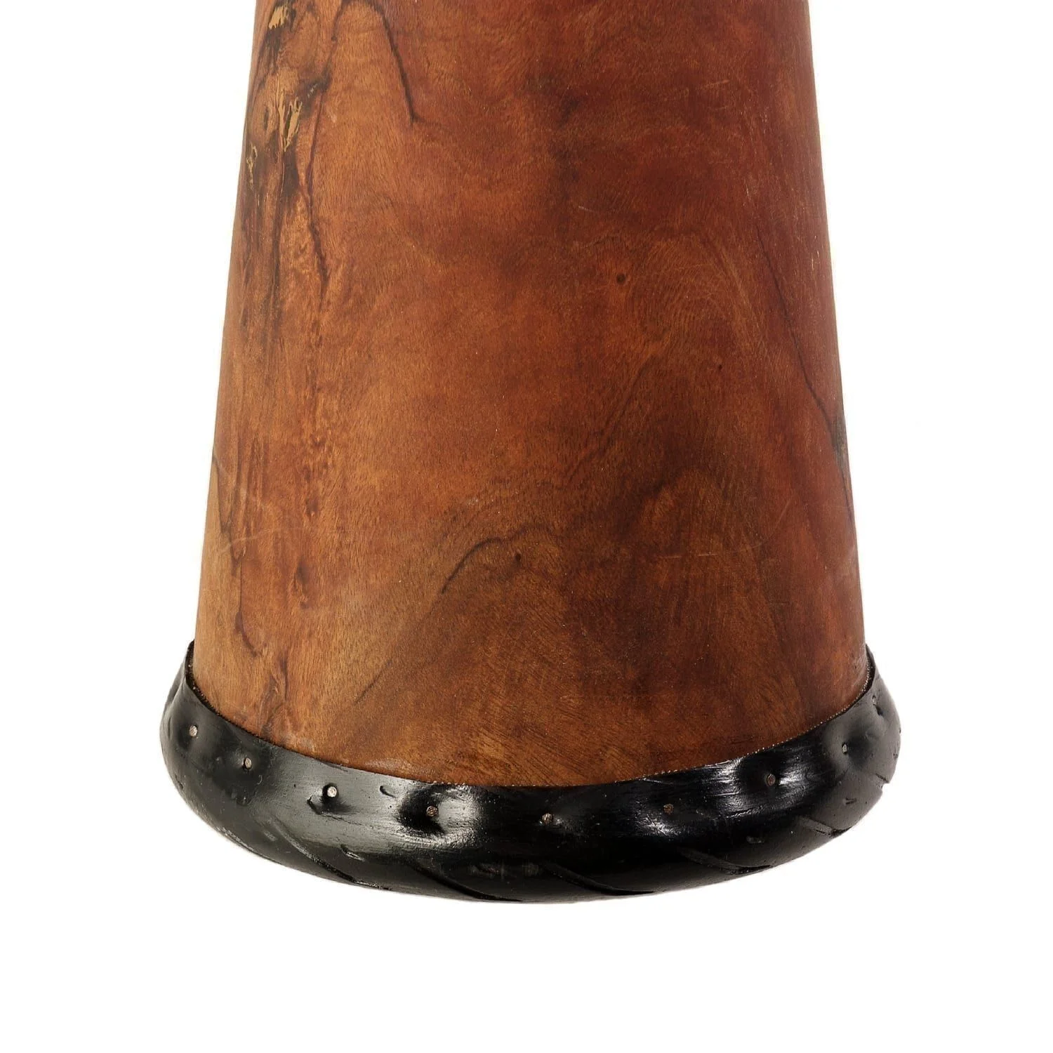 Close-up of a handcrafted wooden djembe drum base with a polished finish and decorative black rim, highlighting intricate craftsmanship.