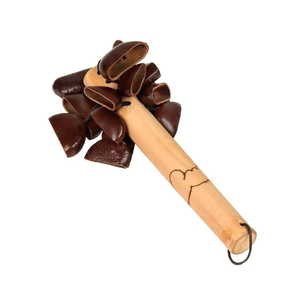 This is a product shot of a Bento Shaker, diagonal shot. It has a wooden or bamboo handle with a design burnt into the wood. At the top are many Bento seeds are attached which make the shaker sound.