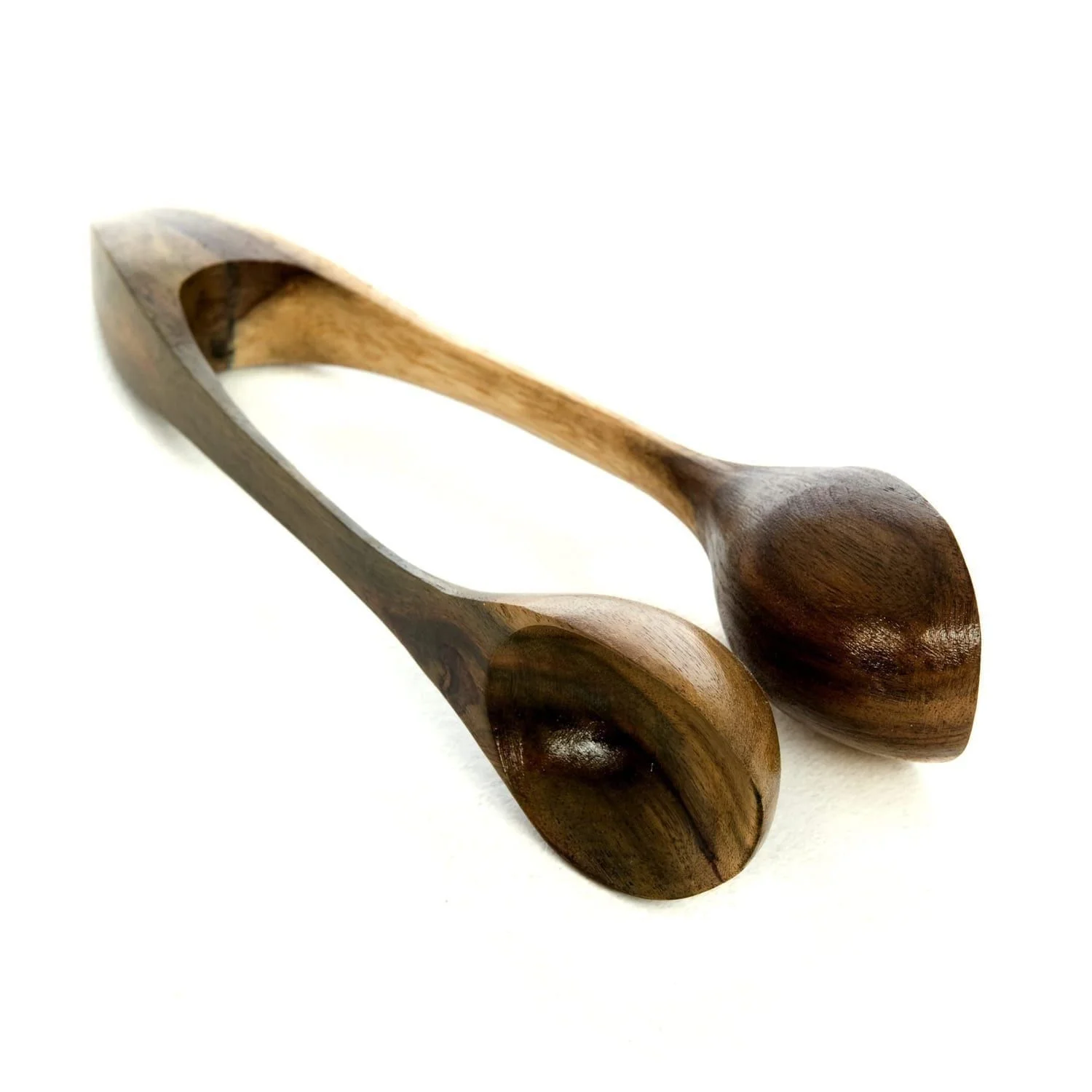 Hand-carved wooden spoons instrument from Suar wood. Play by slapping on hand or leg for fun clippity-clop tones.