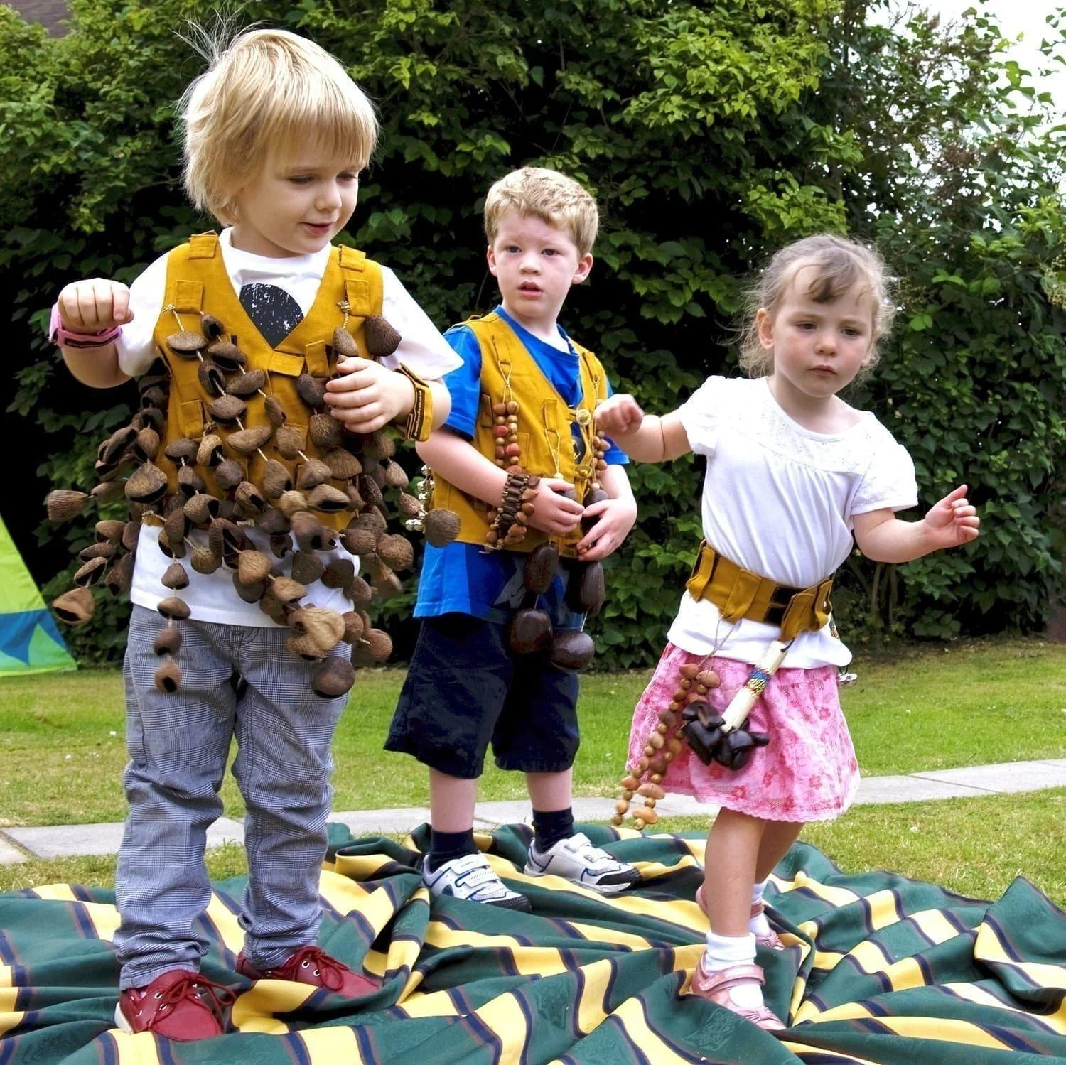 Image of preschool students playing with Drums for Schools' music tunic and music belt