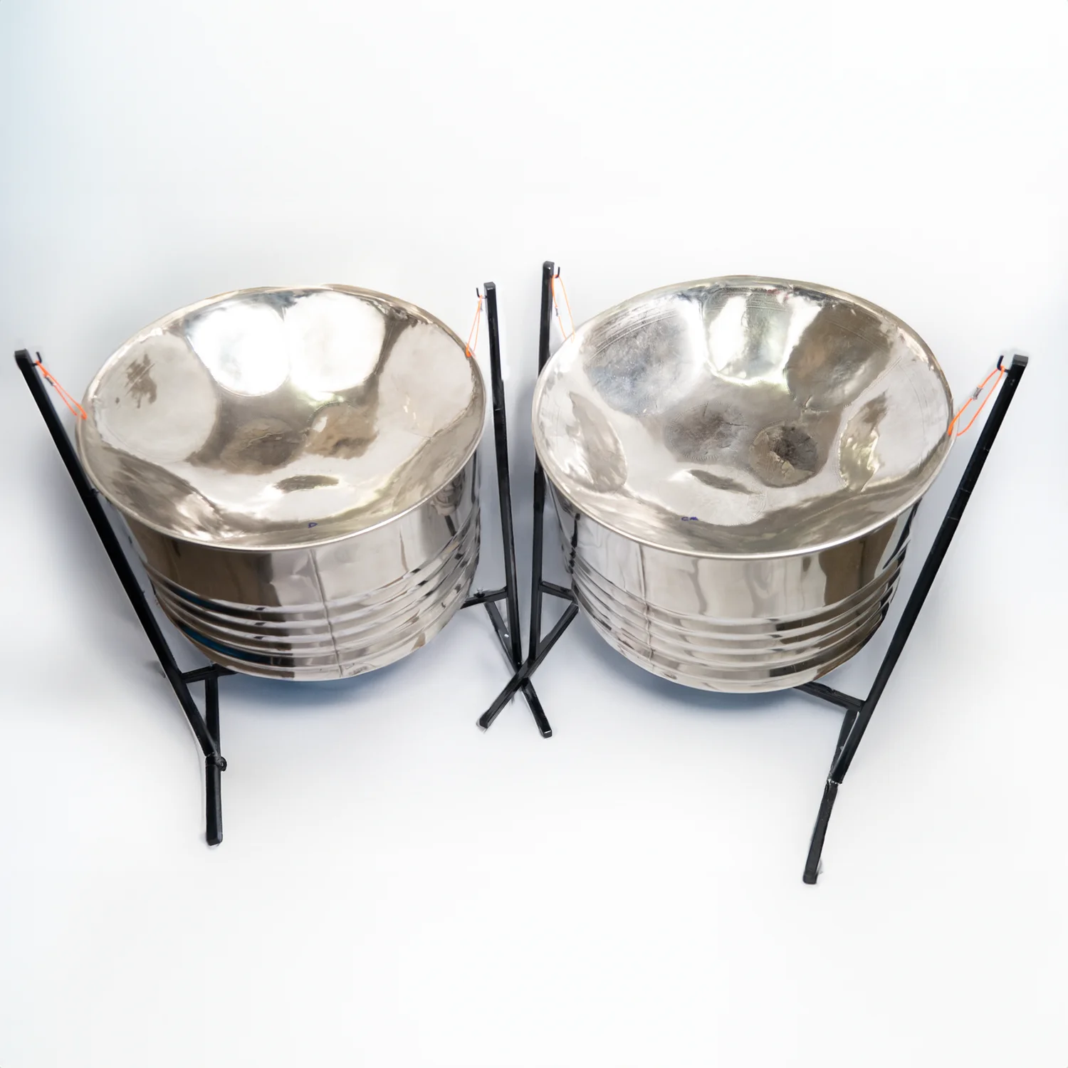 Chrome double guitar steel pan set with stands and mallets, ideal for vibrant Caribbean rhythms and professional performances.